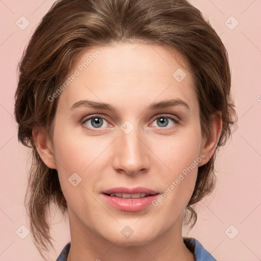 Joyful white young-adult female with medium  brown hair and blue eyes