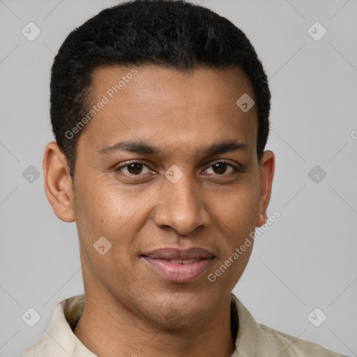 Joyful black young-adult male with short  brown hair and brown eyes