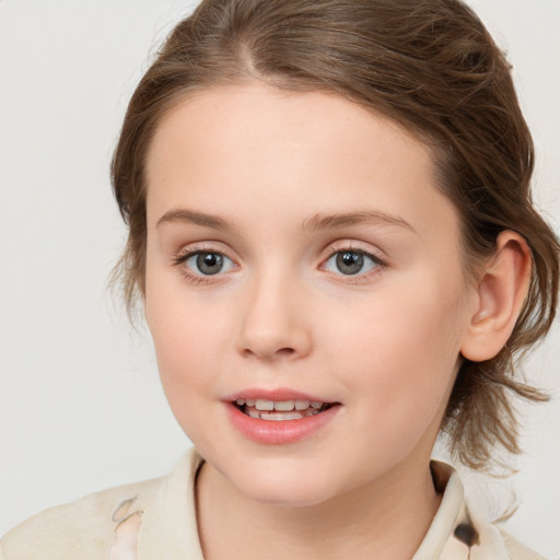 Joyful white child female with medium  brown hair and brown eyes