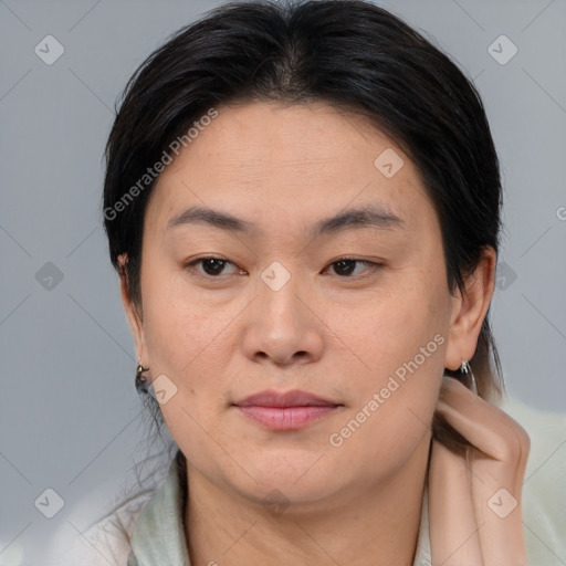 Joyful asian young-adult female with medium  brown hair and brown eyes