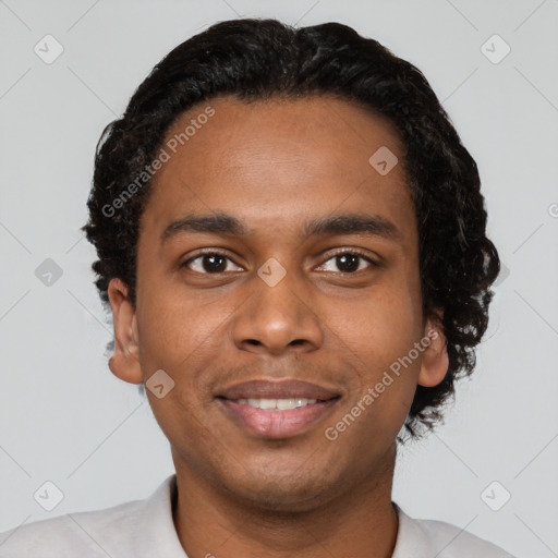 Joyful black young-adult male with short  black hair and brown eyes