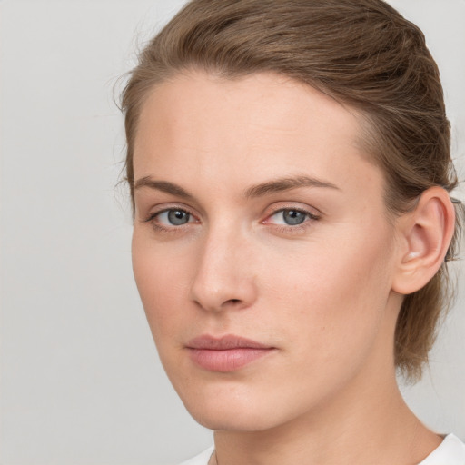 Neutral white young-adult female with medium  brown hair and grey eyes