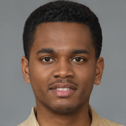 Joyful latino young-adult male with short  brown hair and brown eyes