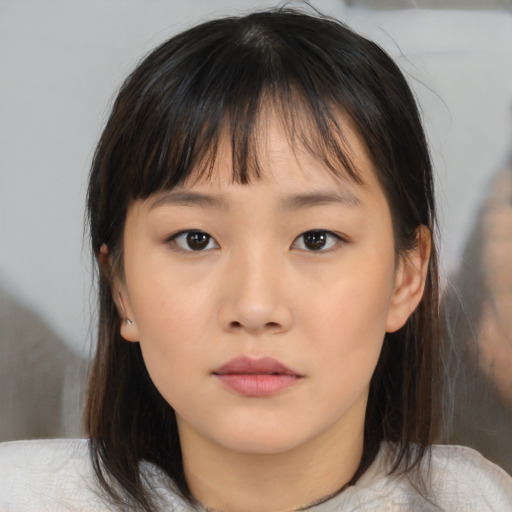 Neutral asian young-adult female with medium  brown hair and brown eyes