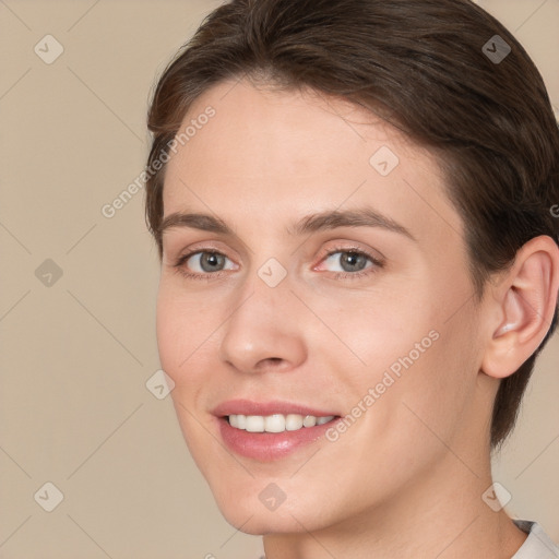 Joyful white young-adult female with short  brown hair and brown eyes