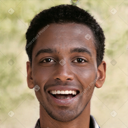 Joyful black young-adult male with short  brown hair and brown eyes