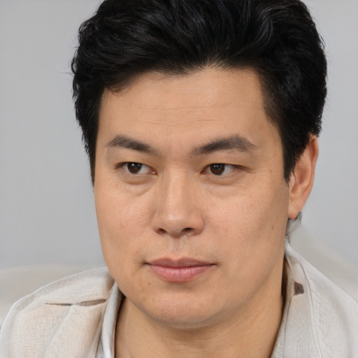 Neutral asian young-adult male with short  brown hair and brown eyes