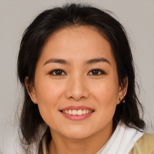 Joyful white young-adult female with medium  brown hair and brown eyes