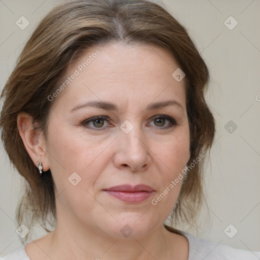 Joyful white adult female with medium  brown hair and brown eyes