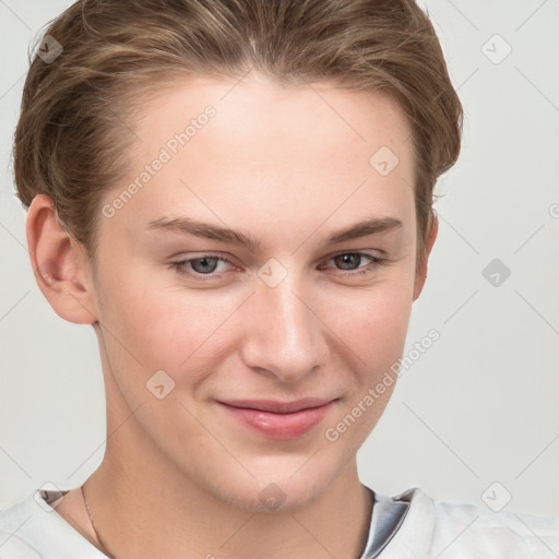 Joyful white young-adult female with short  brown hair and grey eyes