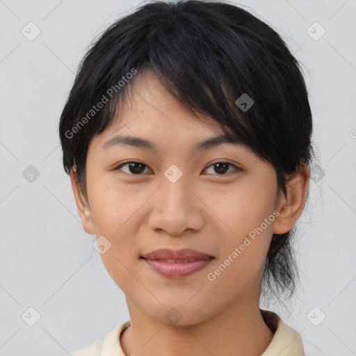 Joyful asian young-adult female with medium  brown hair and brown eyes