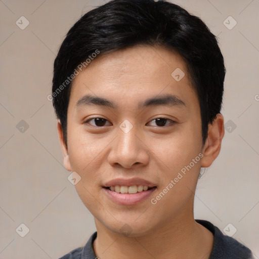 Joyful asian young-adult male with short  black hair and brown eyes