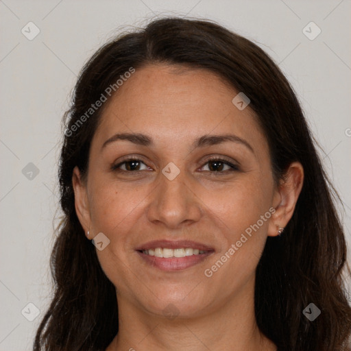 Joyful white adult female with long  brown hair and brown eyes