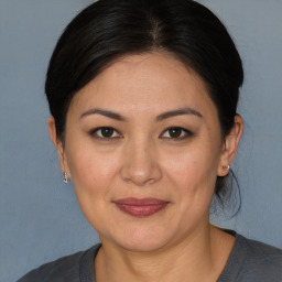 Joyful white adult female with medium  brown hair and brown eyes