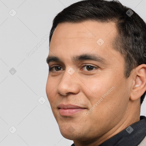 Joyful white adult male with short  brown hair and brown eyes