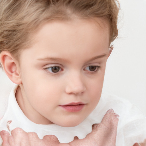 Joyful white child female with medium  brown hair and blue eyes