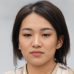 Neutral asian young-adult female with medium  brown hair and brown eyes