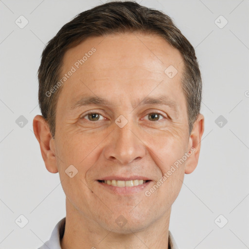 Joyful white adult male with short  brown hair and brown eyes