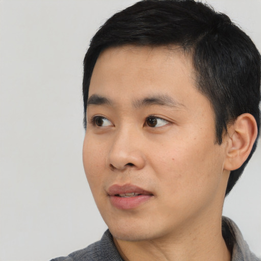 Neutral asian young-adult male with short  black hair and brown eyes