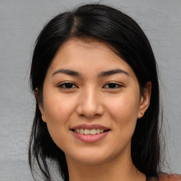 Joyful asian young-adult female with medium  black hair and brown eyes