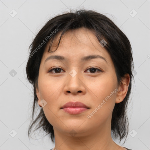 Joyful asian young-adult female with medium  brown hair and brown eyes