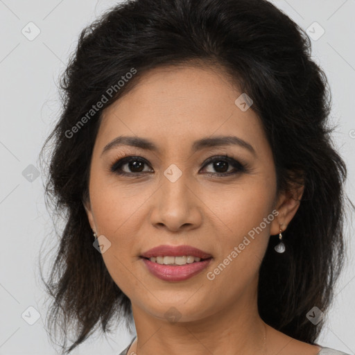 Joyful latino young-adult female with medium  brown hair and brown eyes