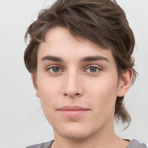 Neutral white young-adult male with medium  brown hair and grey eyes