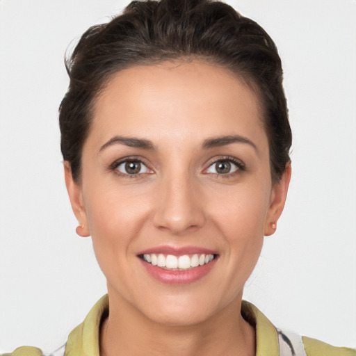 Joyful white young-adult female with short  brown hair and brown eyes