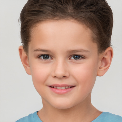 Joyful white child female with short  brown hair and brown eyes