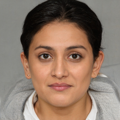 Joyful white young-adult female with medium  brown hair and brown eyes
