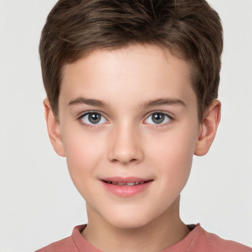 Joyful white child male with short  brown hair and brown eyes