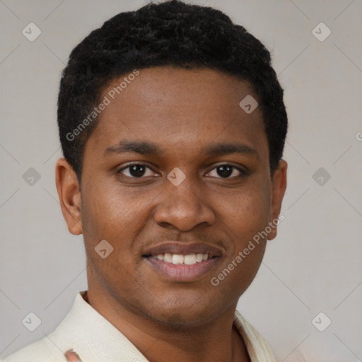 Joyful black young-adult male with short  brown hair and brown eyes
