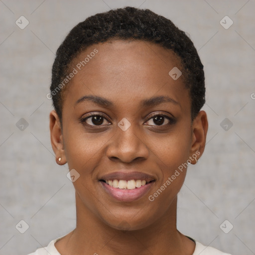 Joyful black young-adult female with short  black hair and brown eyes