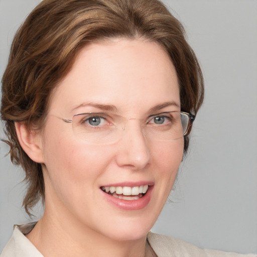 Joyful white young-adult female with medium  brown hair and blue eyes