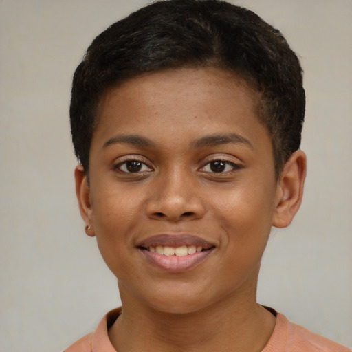 Joyful black child female with short  brown hair and brown eyes