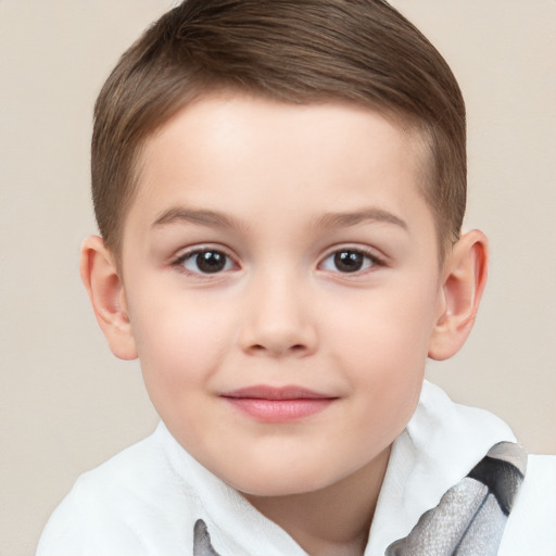 Joyful white child male with short  brown hair and brown eyes