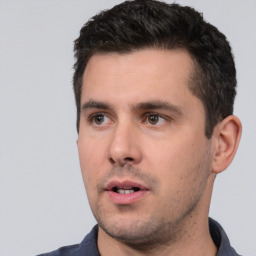 Neutral white young-adult male with short  black hair and brown eyes