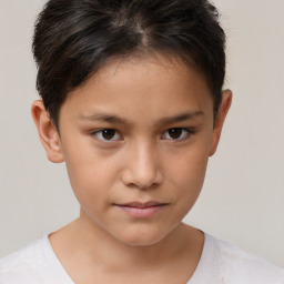 Joyful white child female with short  brown hair and brown eyes