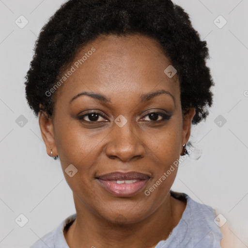 Joyful black adult female with short  brown hair and brown eyes