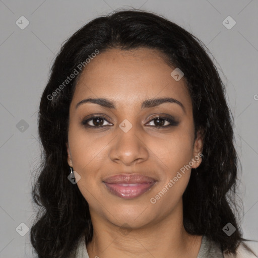 Joyful black young-adult female with long  black hair and brown eyes