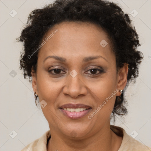 Joyful black adult female with short  brown hair and brown eyes