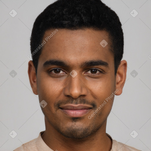 Joyful black young-adult male with short  black hair and brown eyes