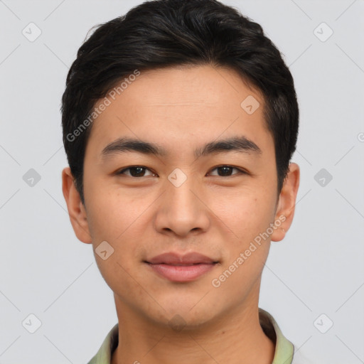 Joyful asian young-adult male with short  brown hair and brown eyes