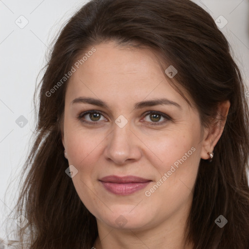 Joyful white adult female with long  brown hair and brown eyes