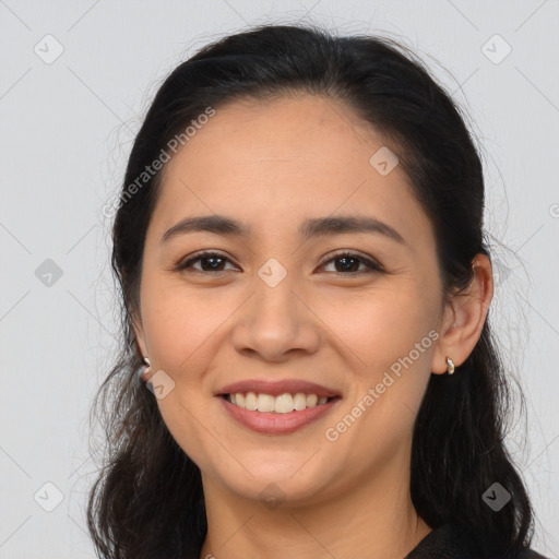 Joyful latino young-adult female with long  brown hair and brown eyes
