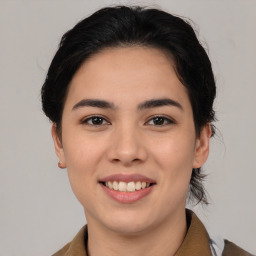 Joyful white young-adult female with medium  brown hair and brown eyes