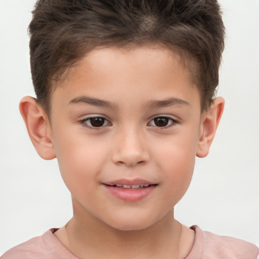 Joyful white child male with short  brown hair and brown eyes