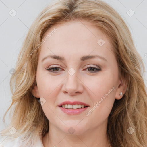 Joyful white young-adult female with long  brown hair and blue eyes