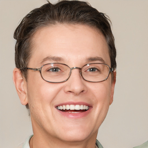 Joyful white adult male with short  brown hair and grey eyes