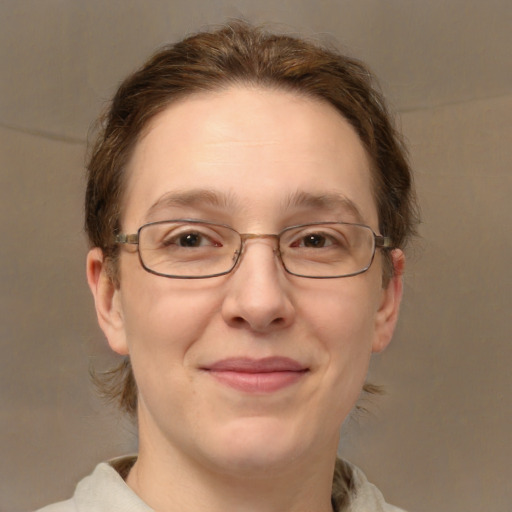 Joyful white adult female with medium  brown hair and green eyes